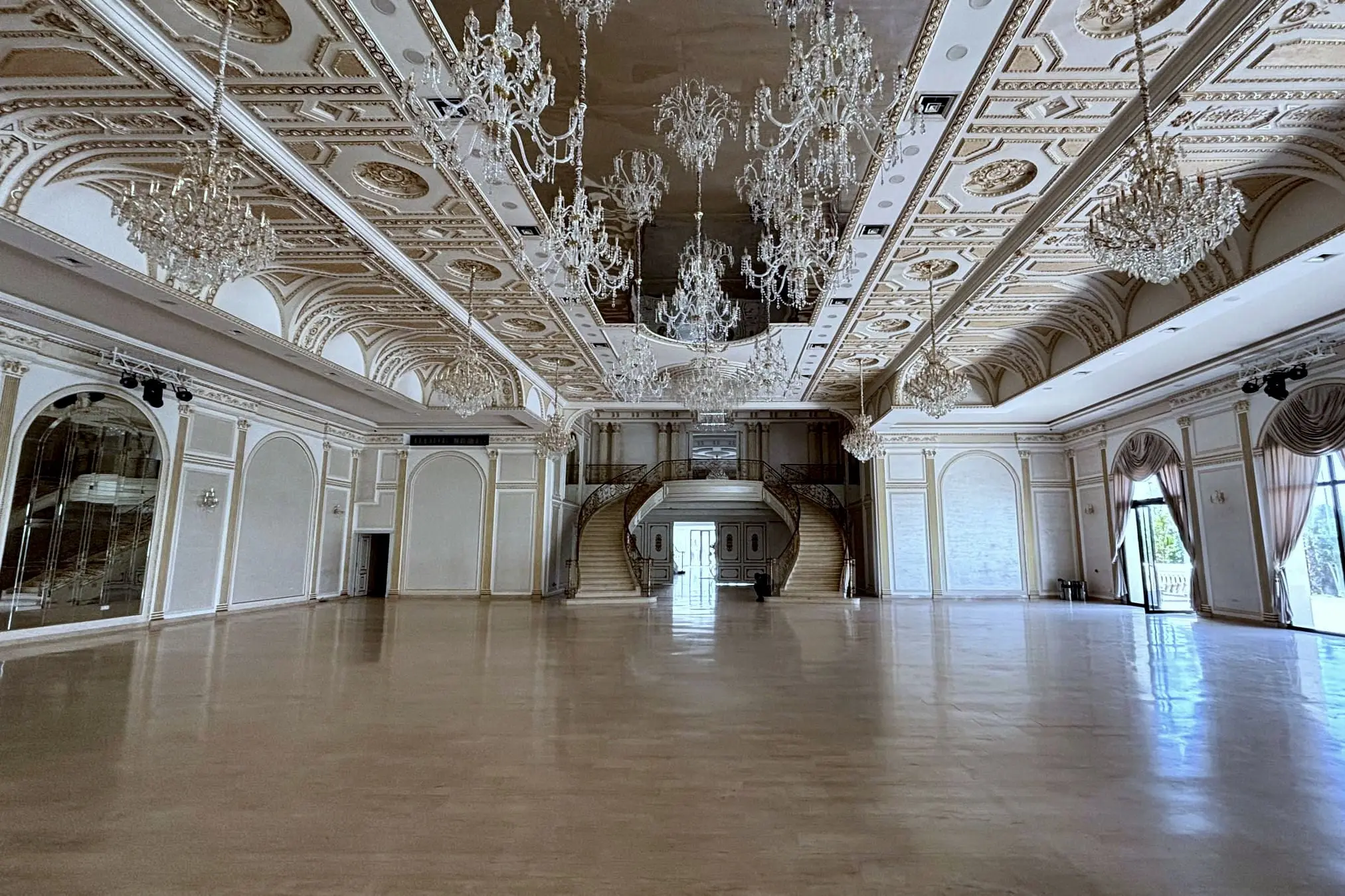 The empty Salle Royale by day, toward the double staircase, parquet and ornate ceiling