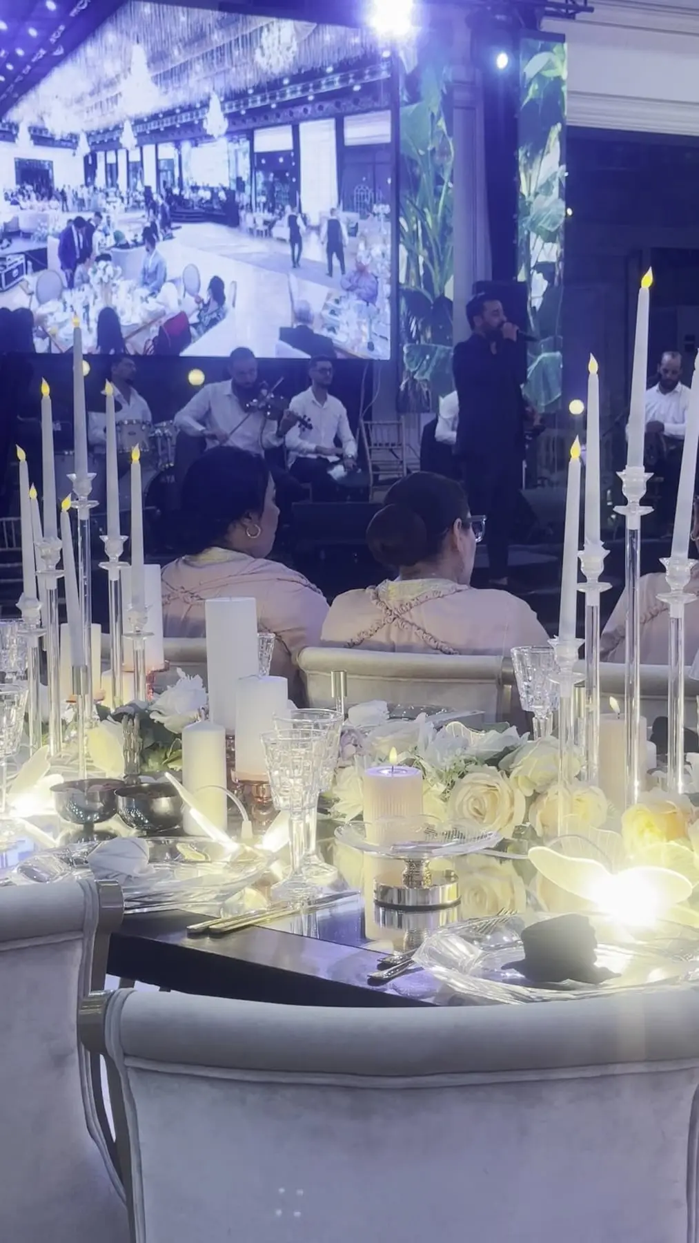 Table detail: crystal, candles and white flowers